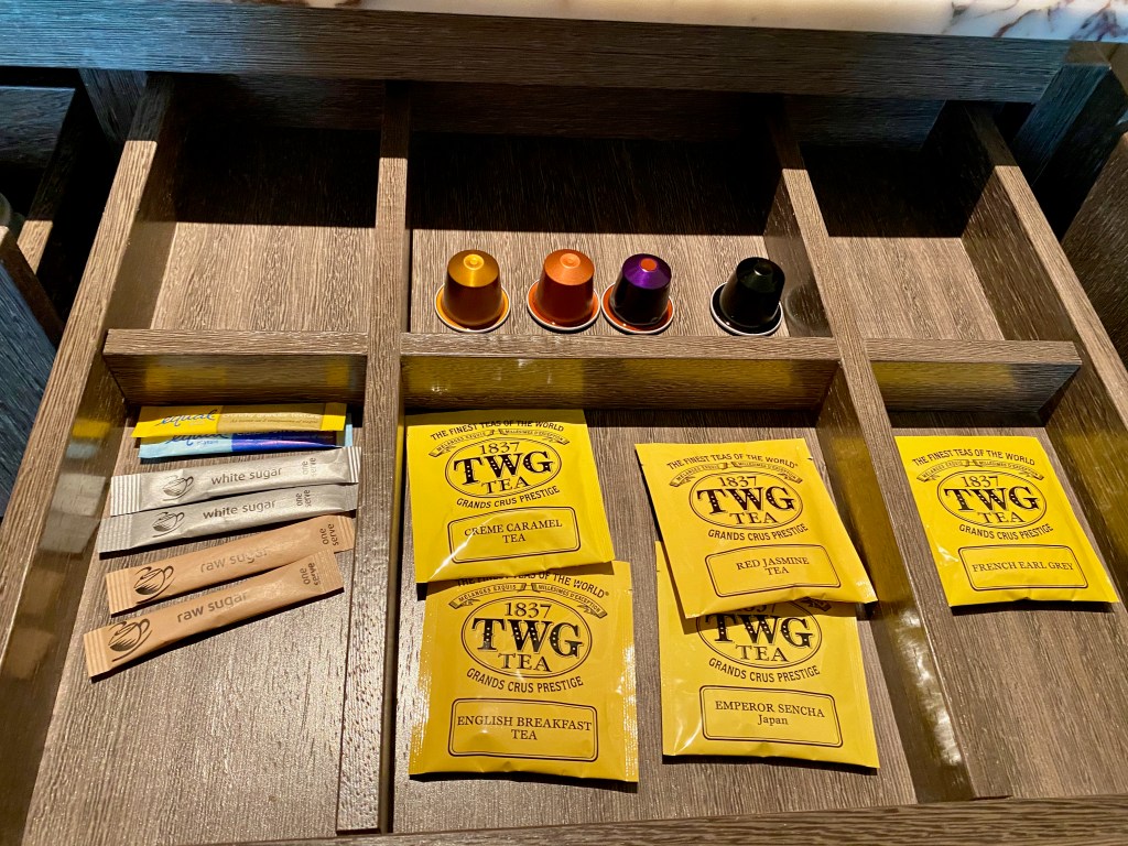 Nespresso capsules and TWG tea bags in minibar