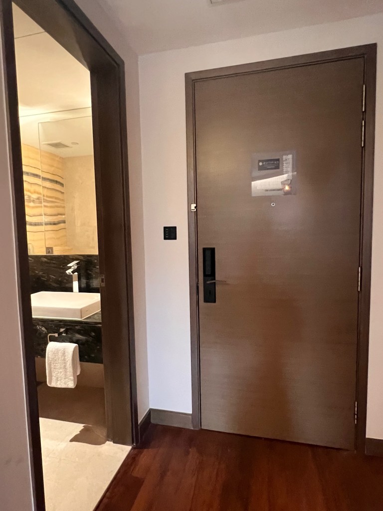 There is a full length mirror at the entryway of the suite